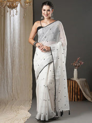 White & Black Floral Printed Zari Silk Cotton SareeSareeThis exquisite saree features a charming floral print, making it an ideal choice for festive occasions where vibrant elegance is celebrated. Adorned with intricate ZWhite & Black Floral Printed Zari Silk Cotton Saree