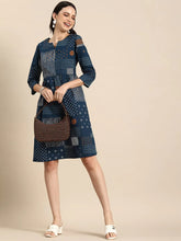 Geometric Printed A-Line Cotton Cambric DressEthnic DressesThis knee-length dress is crafted from woven cotton fabric, featuring a flared hemline and an A-line shape. Its round neck and three-quarter sleeves offer a classic -Line Cotton Cambric Dress