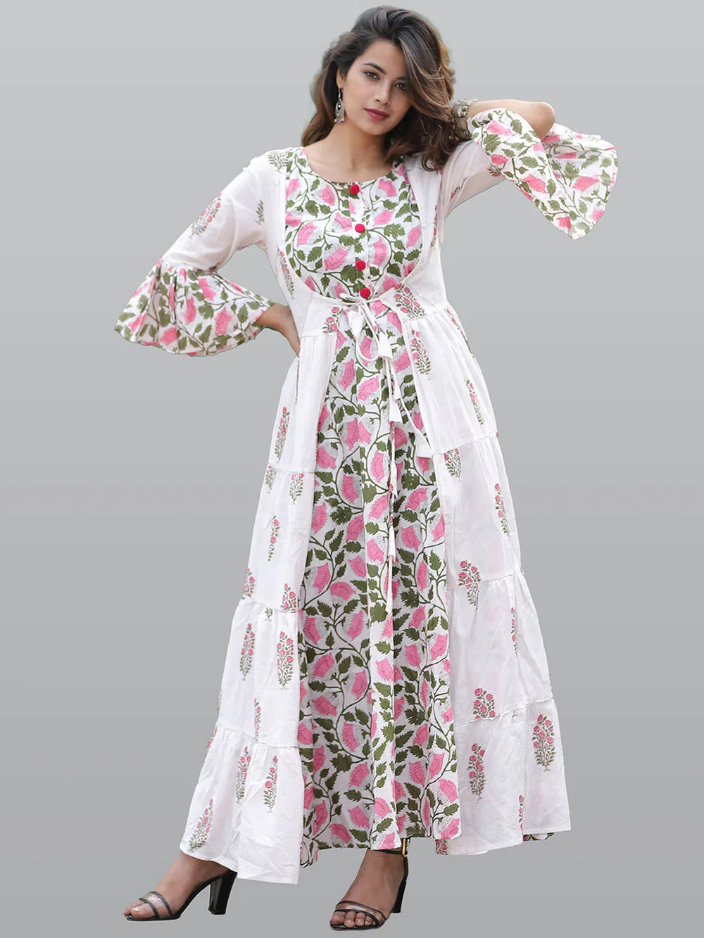 Women White & Pink Floral Printed Flared Sleeves Floral Anarkali KurtaEthnic DressesThis exquisite Anarkali dress boasts long sleeves and a flattering round neck, offering a timeless silhouette that's perfect for daily wear. Adorned with a charming Women White & Pink Floral Printed Flared Sleeves Floral Anarkali Kurta