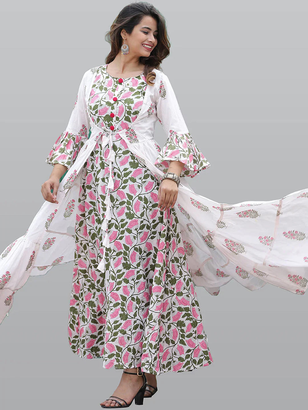 Women White & Pink Floral Printed Flared Sleeves Floral Anarkali KurtaEthnic DressesThis exquisite Anarkali dress boasts long sleeves and a flattering round neck, offering a timeless silhouette that's perfect for daily wear. Adorned with a charming Women White & Pink Floral Printed Flared Sleeves Floral Anarkali Kurta