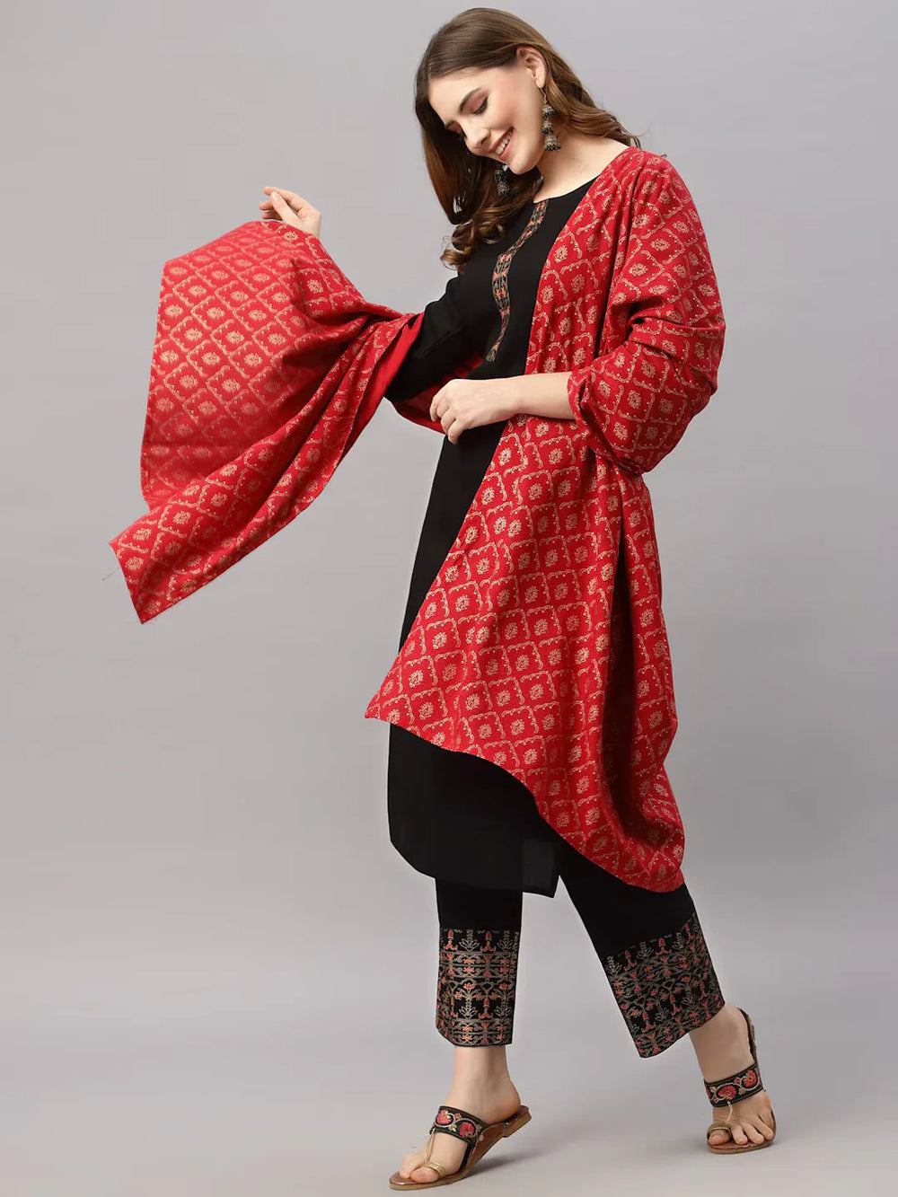 Women Black Kurta with Trousers & With DupattaKurta SetsThis stylish three-piece ensemble comprises a straight-shaped kurta with three-quarter sleeves, offering a classic and comfortable fit for daily wear. The solid pattWomen Black Kurta