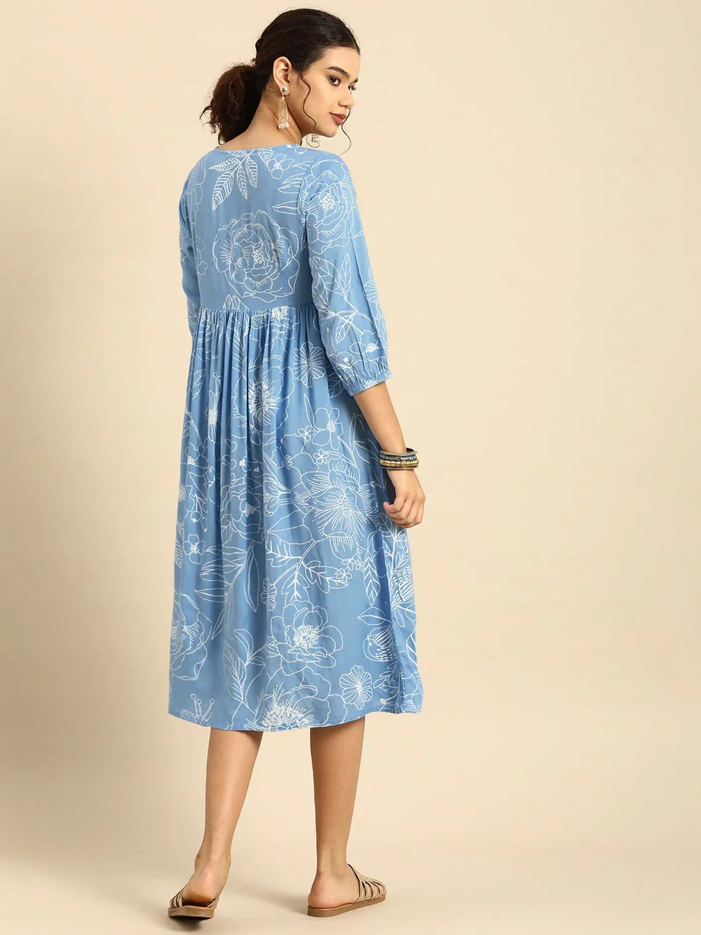Blue & White Floral Square neck Fit N Flare DressEthnic DressesThis charming flared dress is crafted from soft cotton fabric, ensuring comfort and breathability for daily wear. Its flared hemline adds a playful and feminine toucBlue & White Floral Square neck Fit