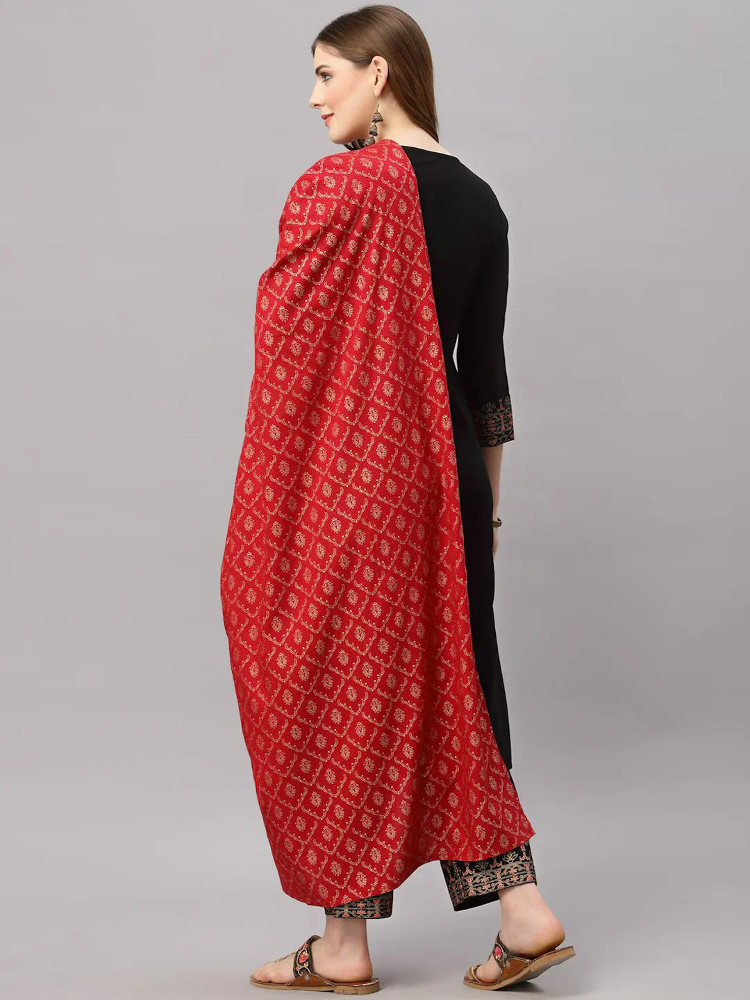 Women Black Kurta with Trousers & With DupattaKurta SetsThis stylish three-piece ensemble comprises a straight-shaped kurta with three-quarter sleeves, offering a classic and comfortable fit for daily wear. The solid pattWomen Black Kurta