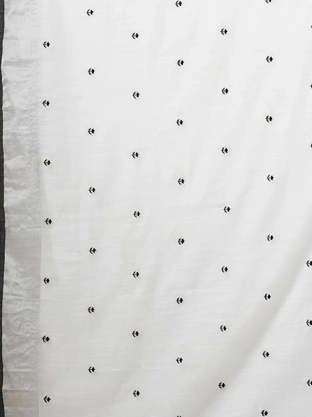 White & Black Floral Printed Zari Silk Cotton SareeSareeThis exquisite saree features a charming floral print, making it an ideal choice for festive occasions where vibrant elegance is celebrated. Adorned with intricate ZWhite & Black Floral Printed Zari Silk Cotton Saree