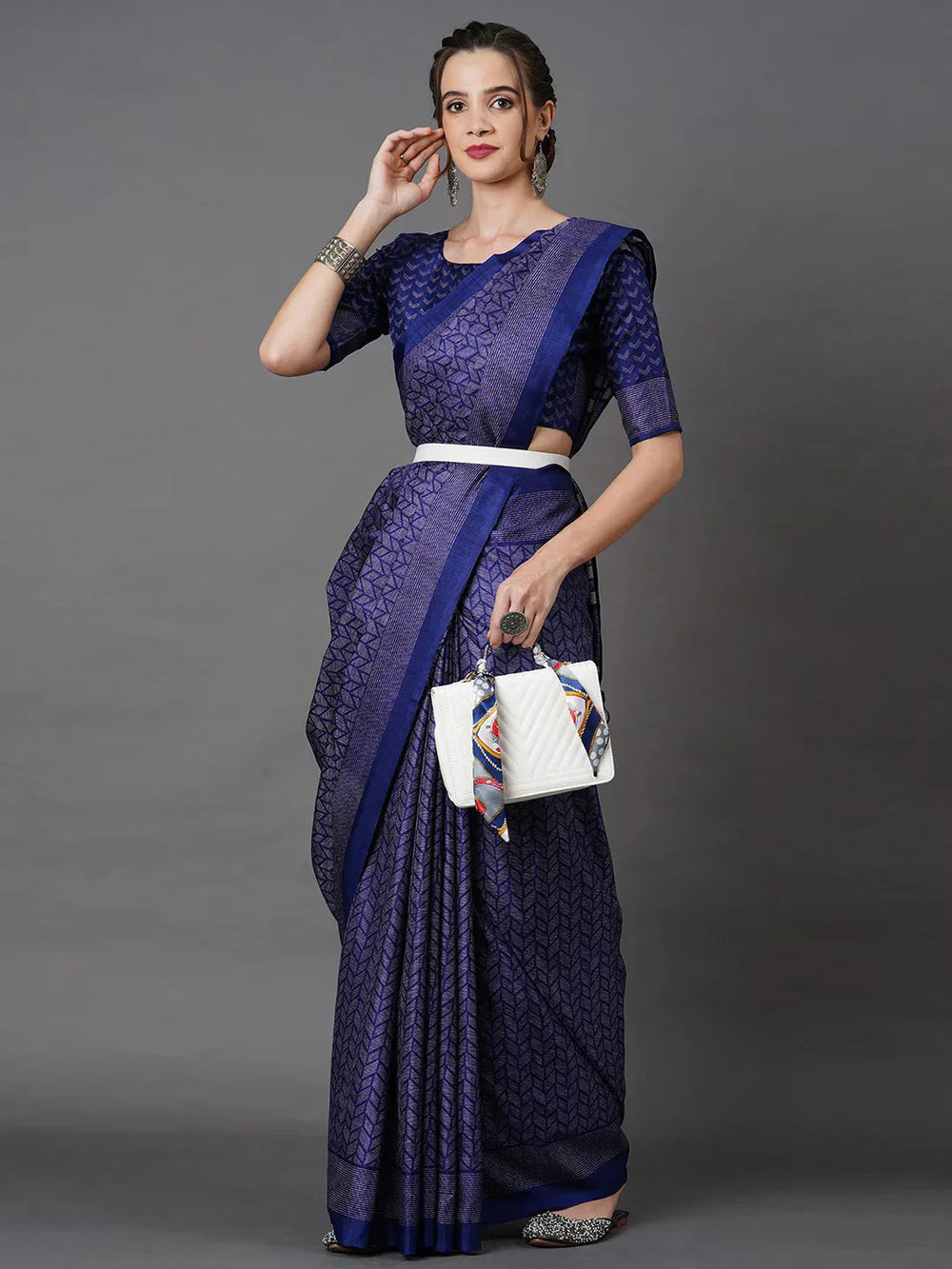 Black Printed Art Silk SareeSareeThis saree embodies festive elegance with its captivating geometric print, offering a modern twist on traditional attire. Perfect for celebratory occasions, the geomBlack Printed Art Silk Saree