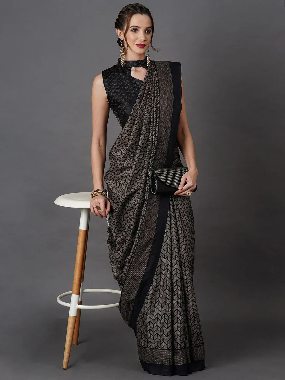 Black Printed Art Silk SareeSareeThis saree embodies festive elegance with its captivating geometric print, offering a modern twist on traditional attire. Perfect for celebratory occasions, the geomBlack Printed Art Silk Saree