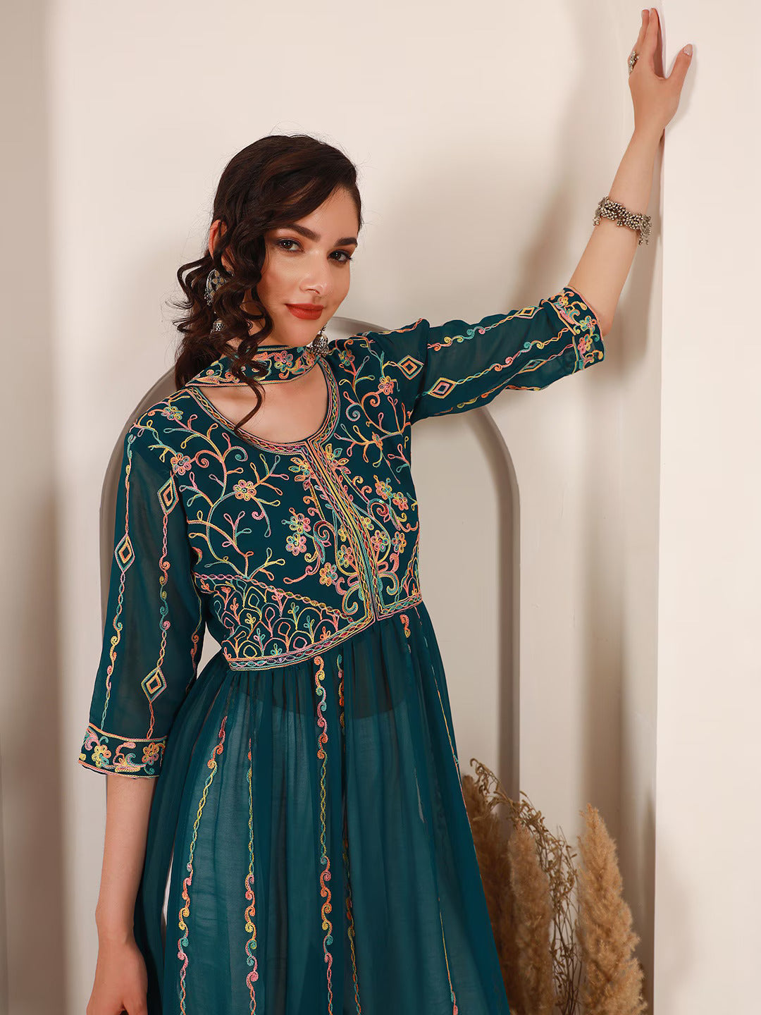 Ethnic Motifs Embroidered A-Line Kurta With DupattaKurta SetsThis elegant dress features three-quarter sleeves and an A-line shape, offering a flattering and comfortable fit. The round neck adds a classic touch to the design, Ethnic Motifs Embroidered