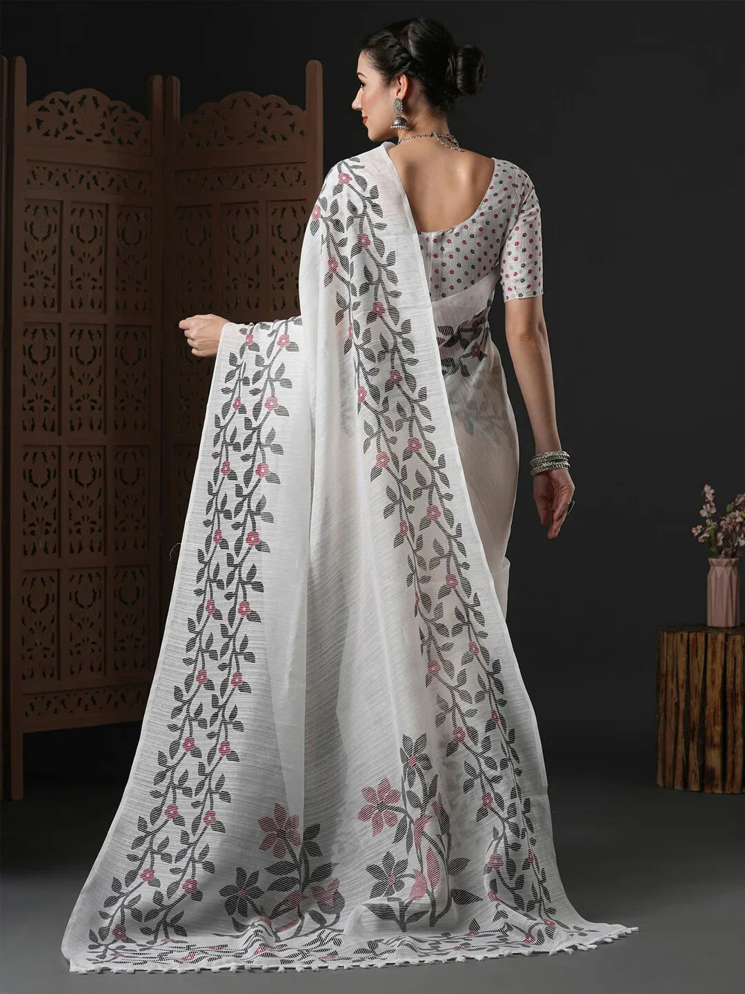 Floral Printed Block Print SareeSareeThis saree epitomizes timeless elegance with its traditional block print design, featuring delicate floral patterns that add a charming touch to its overall aesthetiFloral Printed Block Print Saree