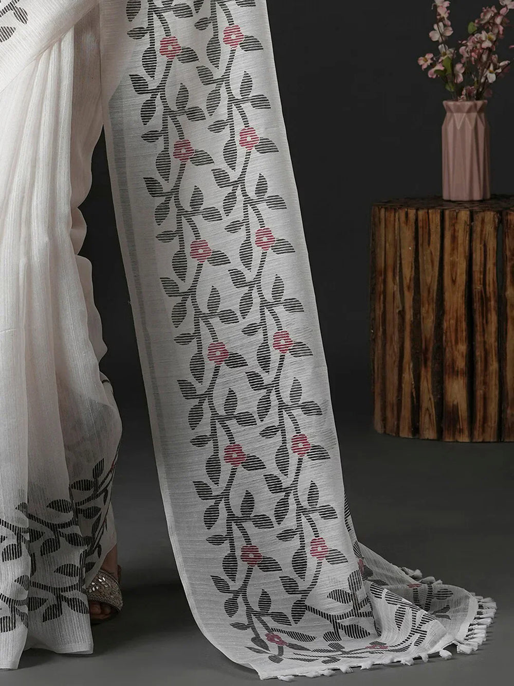 Floral Printed Block Print SareeSareeThis saree epitomizes timeless elegance with its traditional block print design, featuring delicate floral patterns that add a charming touch to its overall aesthetiFloral Printed Block Print Saree