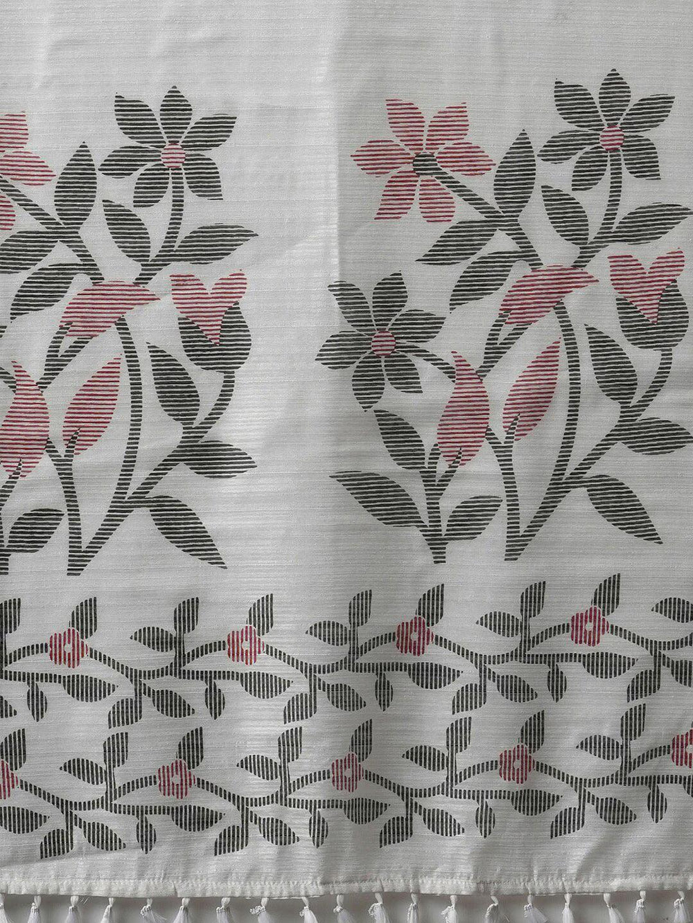 Floral Printed Block Print SareeSareeThis saree epitomizes timeless elegance with its traditional block print design, featuring delicate floral patterns that add a charming touch to its overall aesthetiFloral Printed Block Print Saree