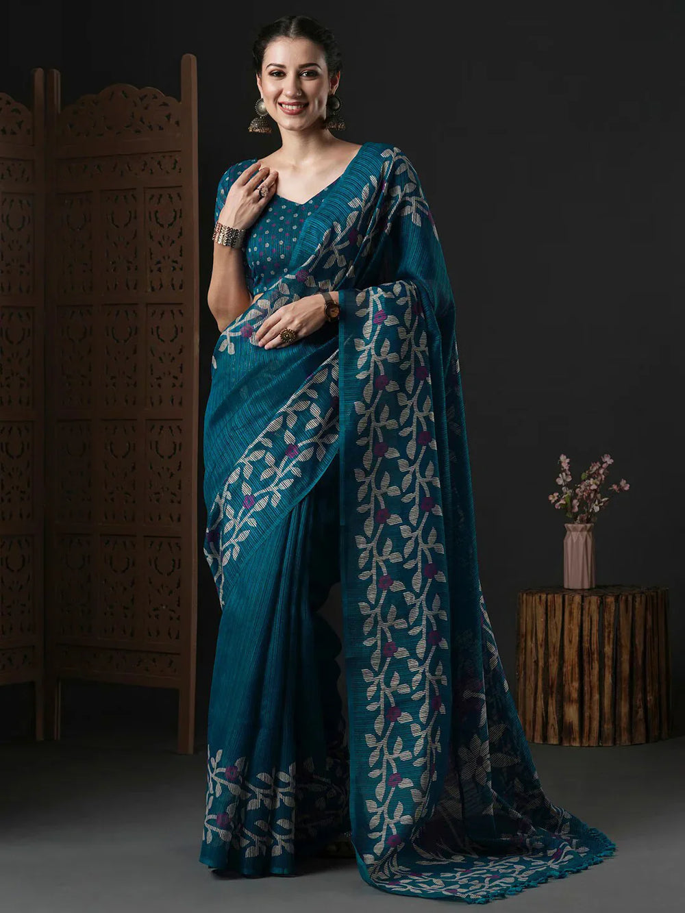 Floral Printed Block Print SareeSareeThis saree epitomizes timeless elegance with its traditional block print design, featuring delicate floral patterns that add a charming touch to its overall aesthetiFloral Printed Block Print Saree