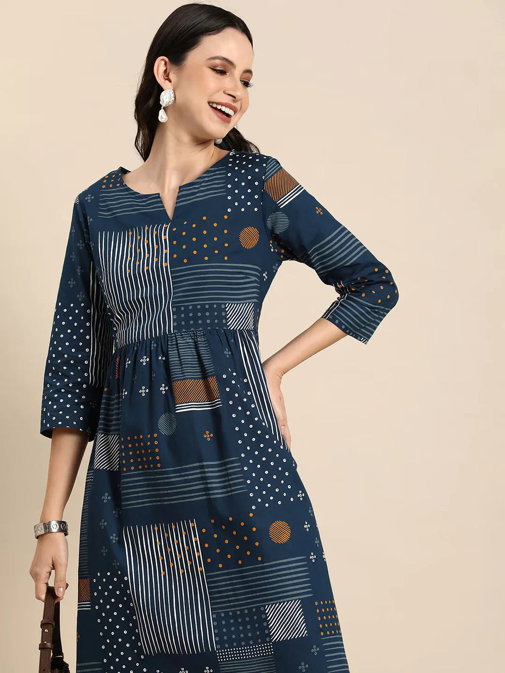 Geometric Printed A-Line Cotton Cambric DressEthnic DressesThis knee-length dress is crafted from woven cotton fabric, featuring a flared hemline and an A-line shape. Its round neck and three-quarter sleeves offer a classic -Line Cotton Cambric Dress