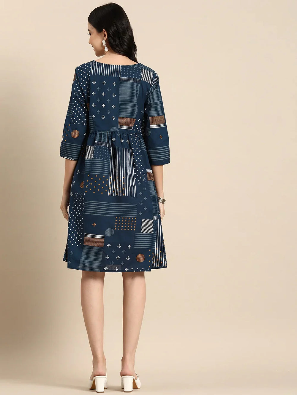 Geometric Printed A-Line Cotton Cambric DressEthnic DressesThis knee-length dress is crafted from woven cotton fabric, featuring a flared hemline and an A-line shape. Its round neck and three-quarter sleeves offer a classic -Line Cotton Cambric Dress