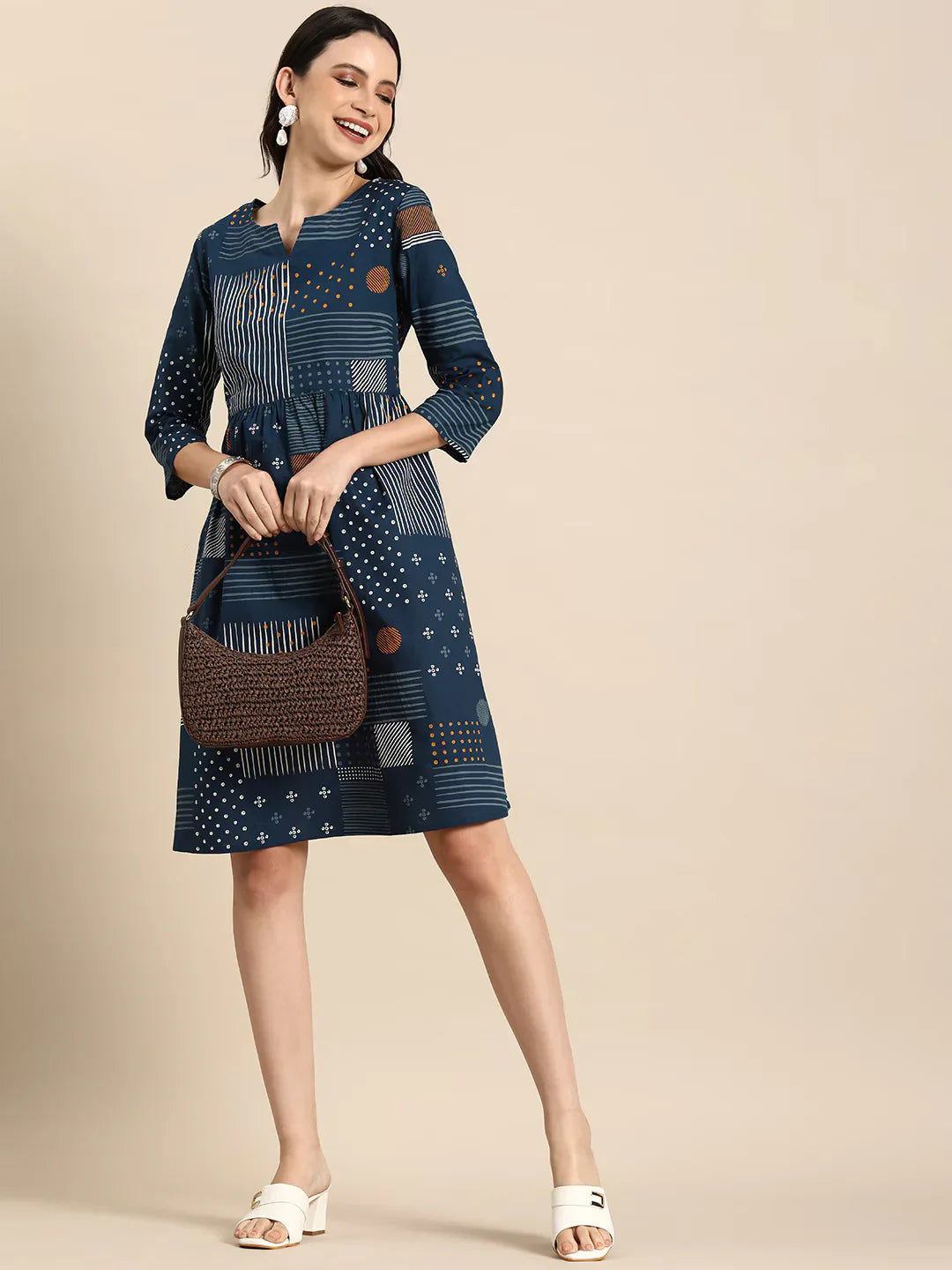 Geometric Printed A-Line Cotton Cambric DressEthnic DressesThis knee-length dress is crafted from woven cotton fabric, featuring a flared hemline and an A-line shape. Its round neck and three-quarter sleeves offer a classic -Line Cotton Cambric Dress