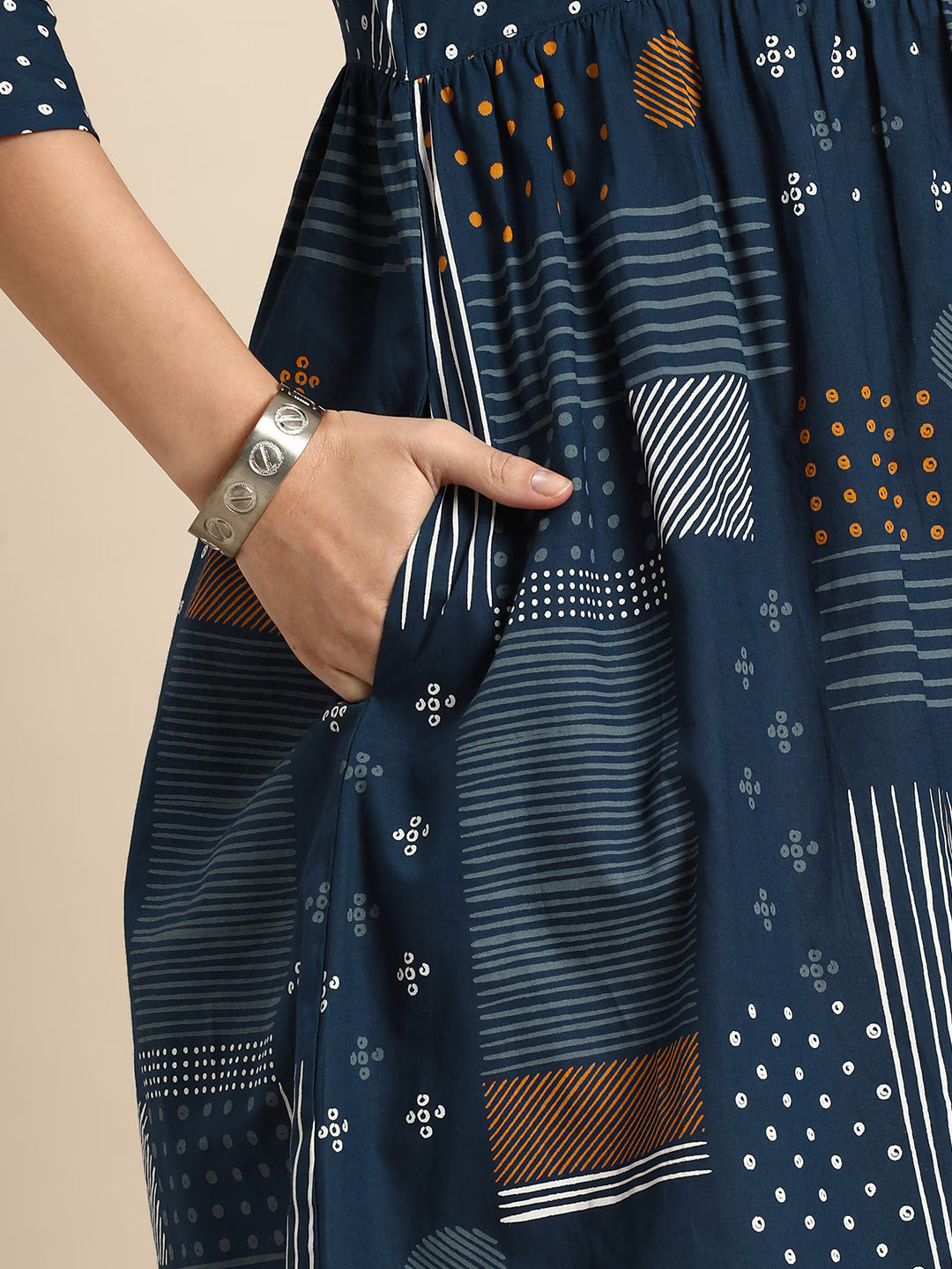 Geometric Printed A-Line Cotton Cambric DressEthnic DressesThis knee-length dress is crafted from woven cotton fabric, featuring a flared hemline and an A-line shape. Its round neck and three-quarter sleeves offer a classic -Line Cotton Cambric Dress