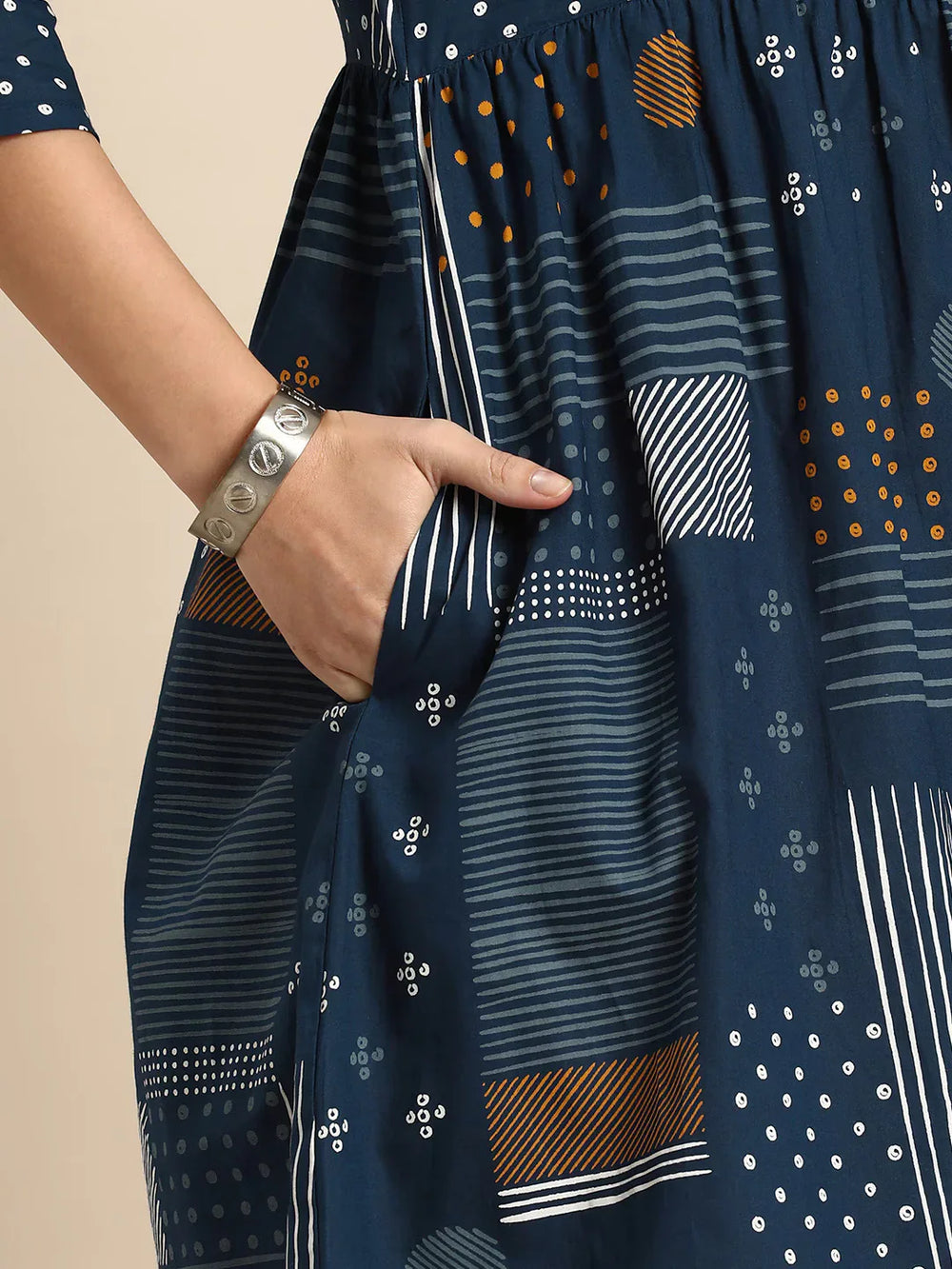 Geometric Printed A-Line Cotton Cambric DressEthnic DressesThis knee-length dress is crafted from woven cotton fabric, featuring a flared hemline and an A-line shape. Its round neck and three-quarter sleeves offer a classic -Line Cotton Cambric Dress