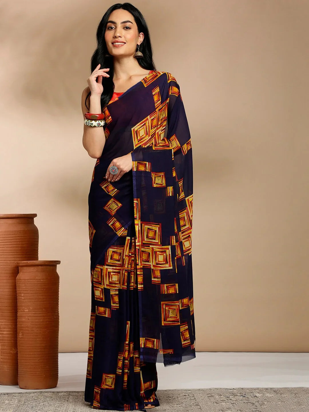Navy Blue Geometric Printed Pure Georgette SareeSareeThis saree features a geometric print pattern, making it suitable for daily wear with its versatile and contemporary design. The absence of a border gives it a cleanNavy Blue Geometric Printed Pure Georgette Saree