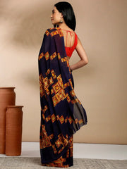 Navy Blue Geometric Printed Pure Georgette SareeSareeThis saree features a geometric print pattern, making it suitable for daily wear with its versatile and contemporary design. The absence of a border gives it a cleanNavy Blue Geometric Printed Pure Georgette Saree