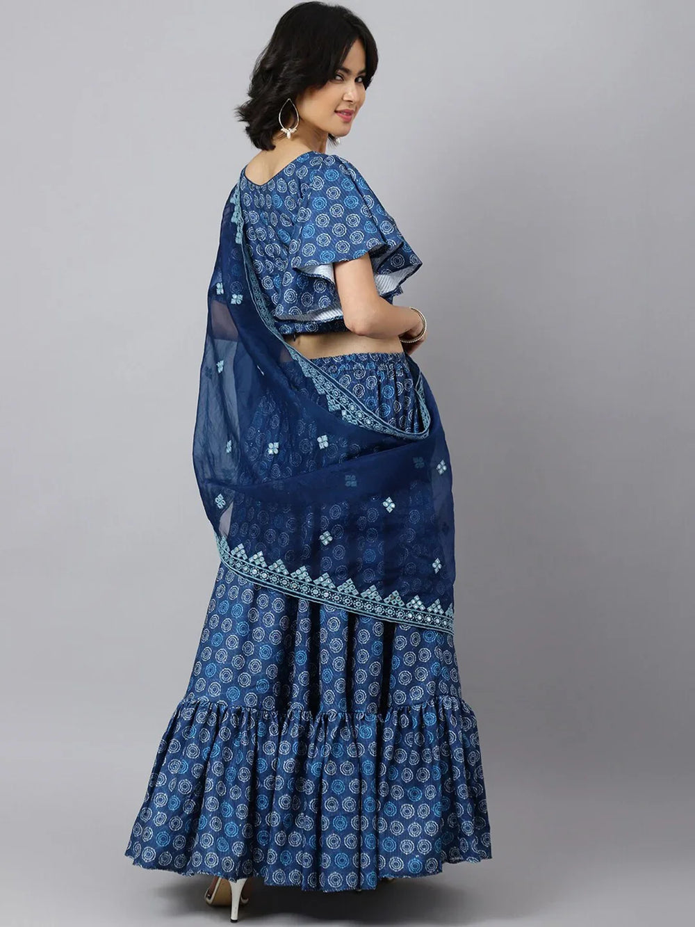 Printed Ikat Ready to Wear Lehenga & Blouse With DupattaLehenga CholisThis exquisite lehenga ensemble features a blend of cotton fabrics, ensuring both comfort and elegance. The lehenga and blouse are crafted from cotton, offering a soPrinted Ikat Ready
