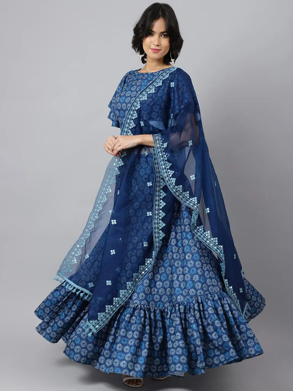 Printed Ikat Ready to Wear Lehenga & Blouse With DupattaLehenga CholisThis exquisite lehenga ensemble features a blend of cotton fabrics, ensuring both comfort and elegance. The lehenga and blouse are crafted from cotton, offering a soPrinted Ikat Ready