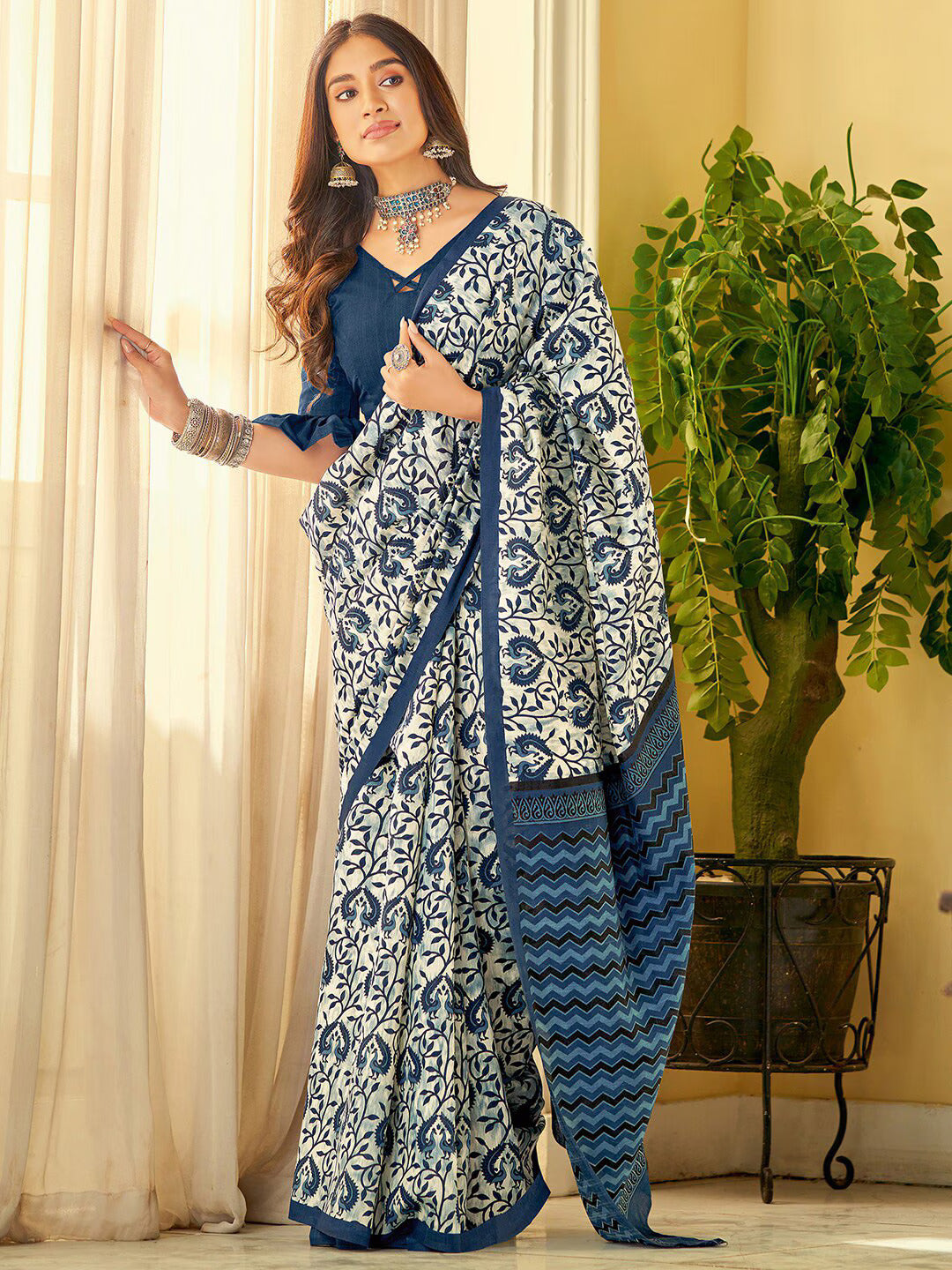 Ethnic Motifs Printed SareeSareeThis stunning saree features intricate ethnic motifs, making it an ideal choice for festive occasions where cultural traditions are celebrated. Its solid border addsEthnic Motifs Printed Saree