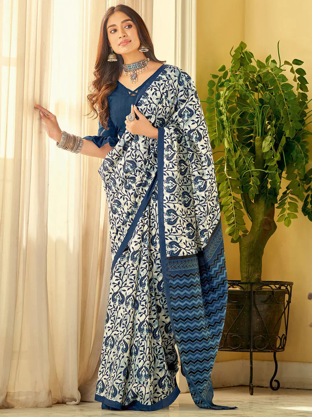 Ethnic Motifs Printed SareeSareeThis stunning saree features intricate ethnic motifs, making it an ideal choice for festive occasions where cultural traditions are celebrated. Its solid border addsEthnic Motifs Printed Saree