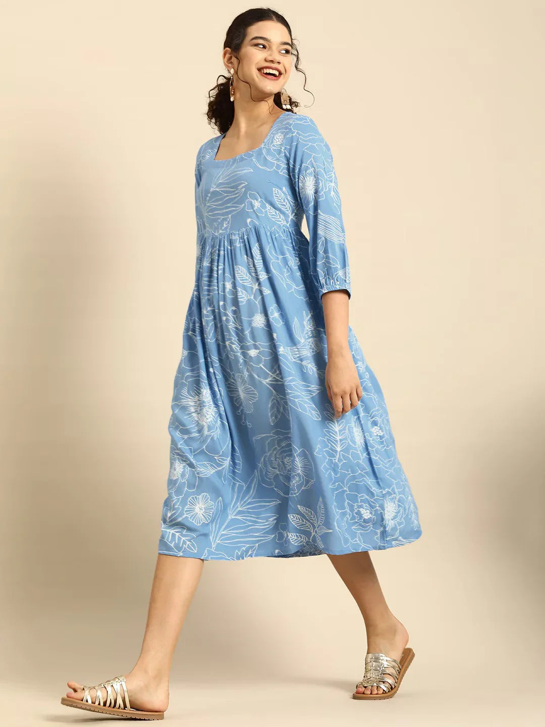 Blue & White Floral Square neck Fit N Flare DressEthnic DressesThis charming flared dress is crafted from soft cotton fabric, ensuring comfort and breathability for daily wear. Its flared hemline adds a playful and feminine toucBlue & White Floral Square neck Fit