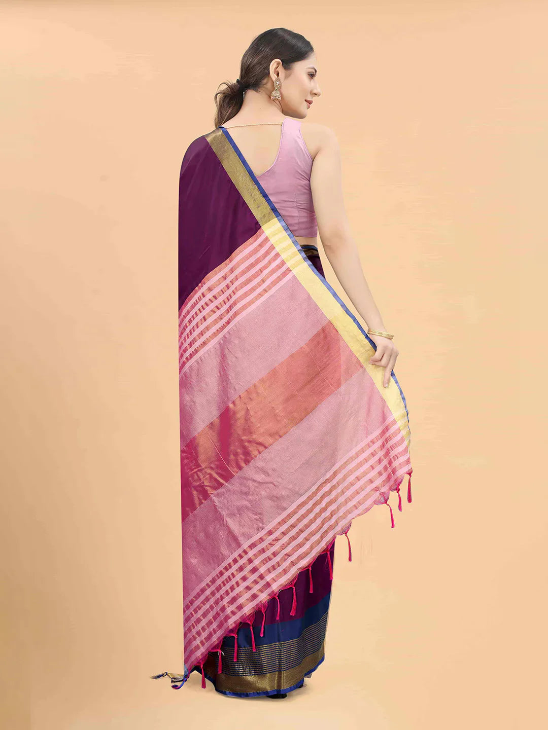 Purple & Pink Zari Art Silk Fusion Arani SareeSareeThe Arani saree exudes timeless elegance with its solid hue, making it perfect for traditional occasions. Ornamented with intricate Zari work along the borders, it ePurple & Pink Zari Art Silk Fusion Arani Saree